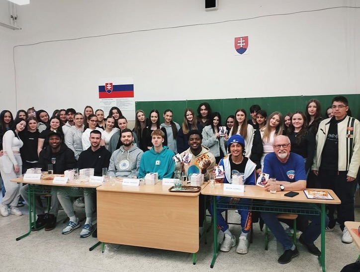 Basketball team visiting a school